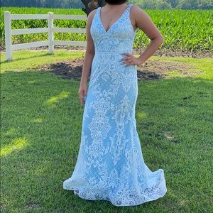 Light blue prom dress with white lace detail. Worn for about 2 hours.
